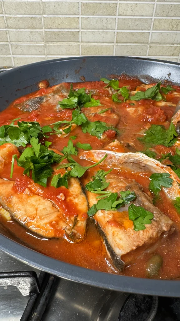 greater amberjack in tomato sauce