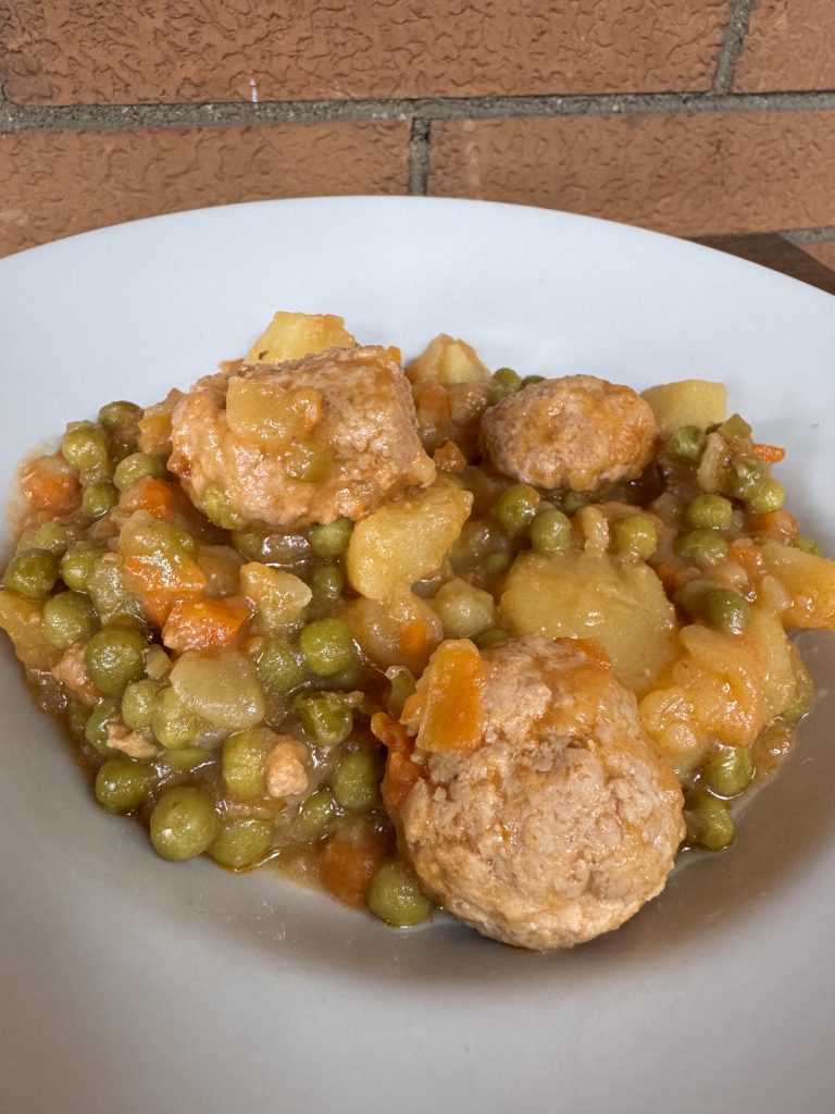 meatballs stew with potatoes and peas